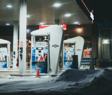 A well-lit gas station surrounded by snow during a winter night in St. John's, NL, Canada.