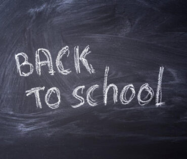 Blackboard with 'Back to School' written in chalk, ideal for educational themes.