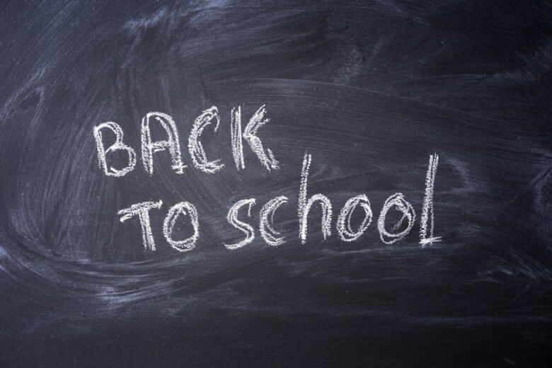 Blackboard with 'Back to School' written in chalk, ideal for educational themes.